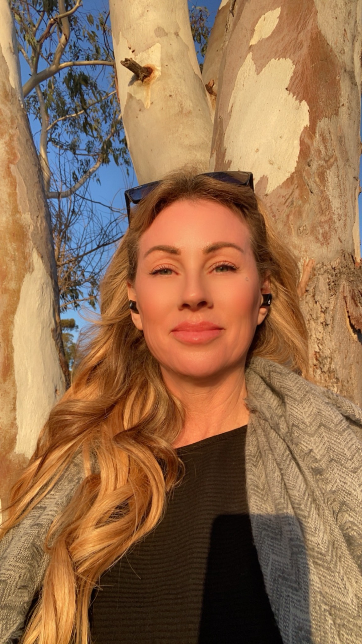 Lori Biesel outdoors in warm natural sunlight, looking at the camera